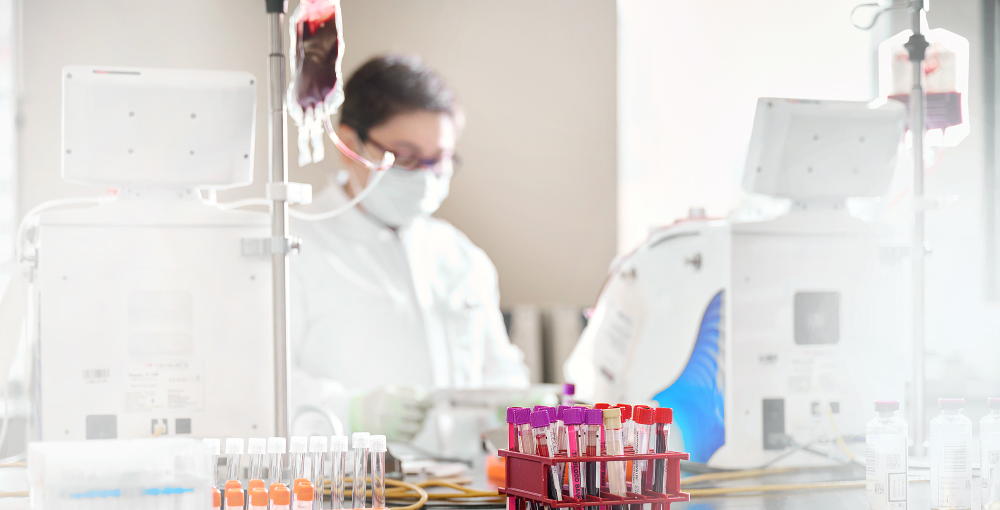 Doctor in lab examining cord blood