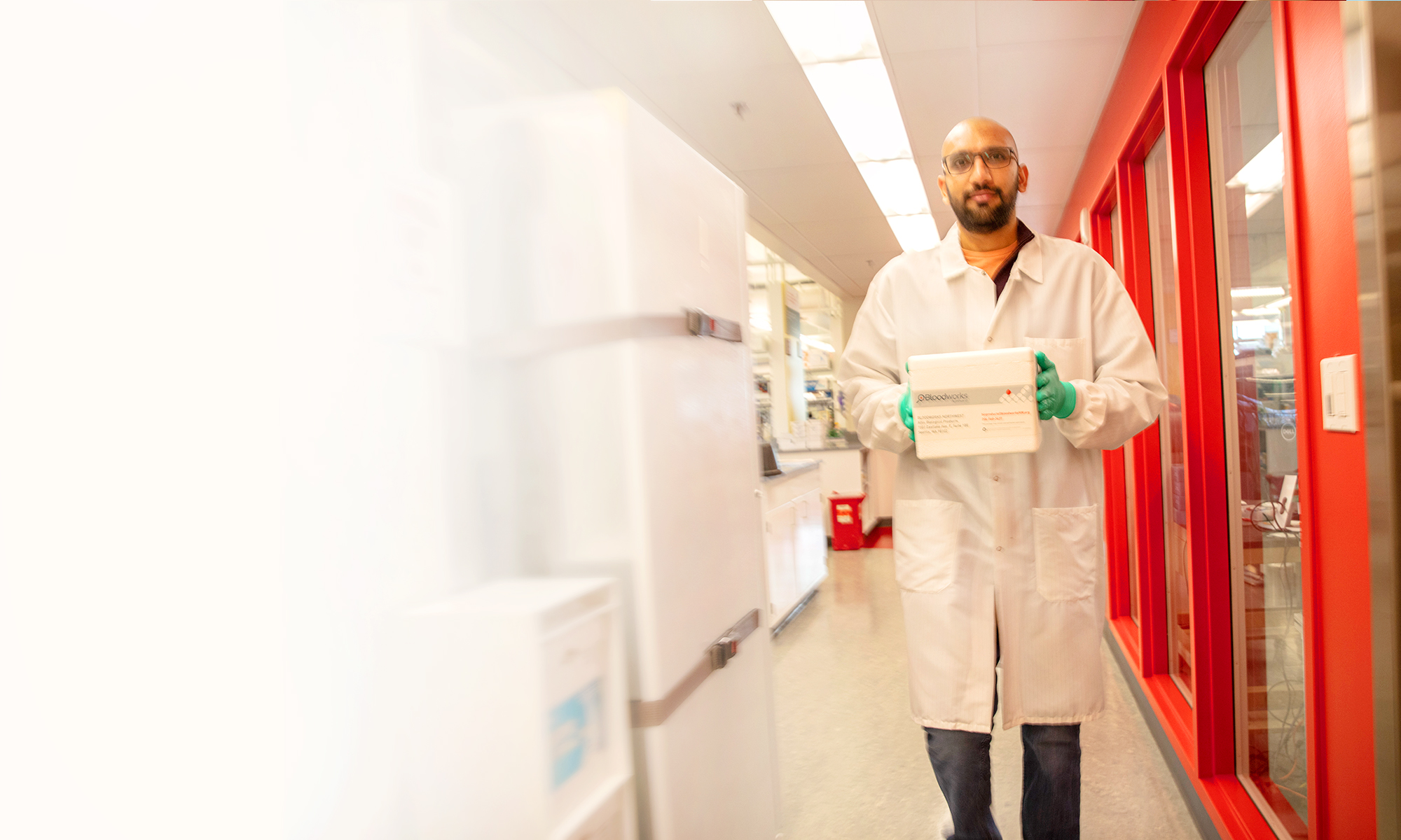 Man In Hospital Holding Donor Box